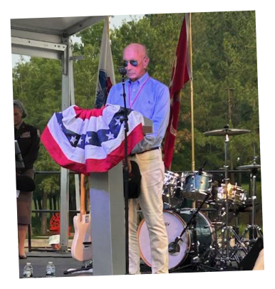 Richard Franks speaking at podium
